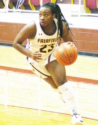 ABOVE, LEFT: Jarahle Daniels drives to the basket for Fairfield. She scored 19 points against Franklin.
